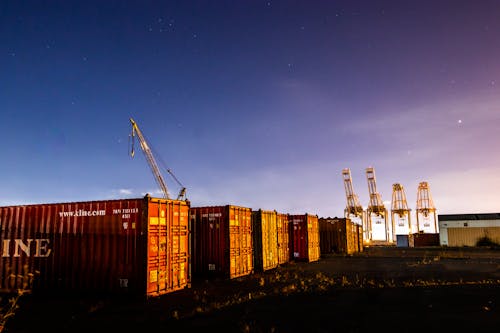 Cargo Containers and Cranes on the Field