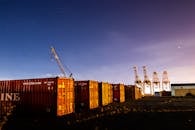 Cargo Containers and Cranes on the Field