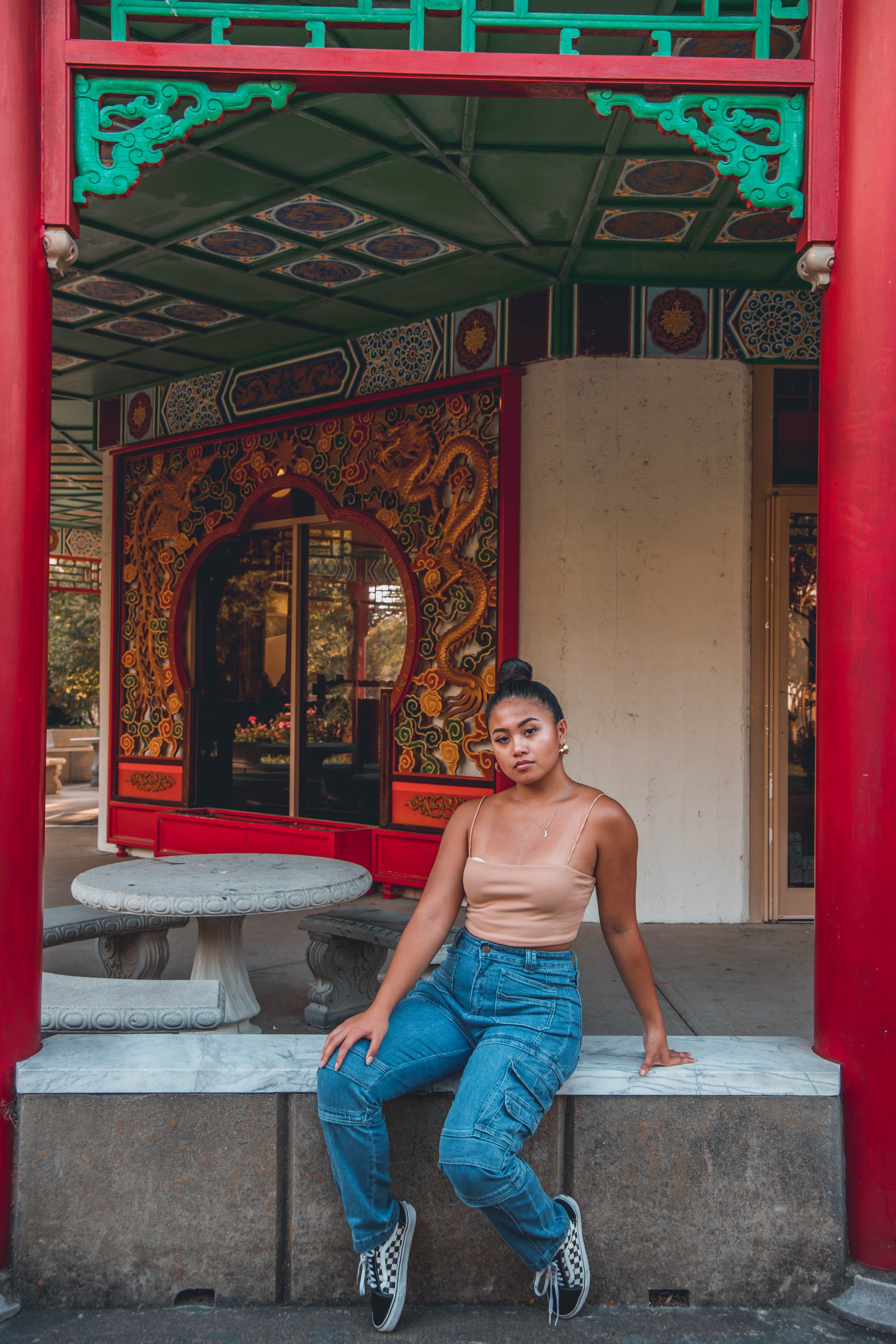 Woman Sitting on a Concrete Bench · Free Stock Photo