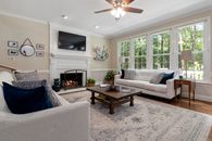 Living Room With White Sofa and Brown Wooden Coffee Table