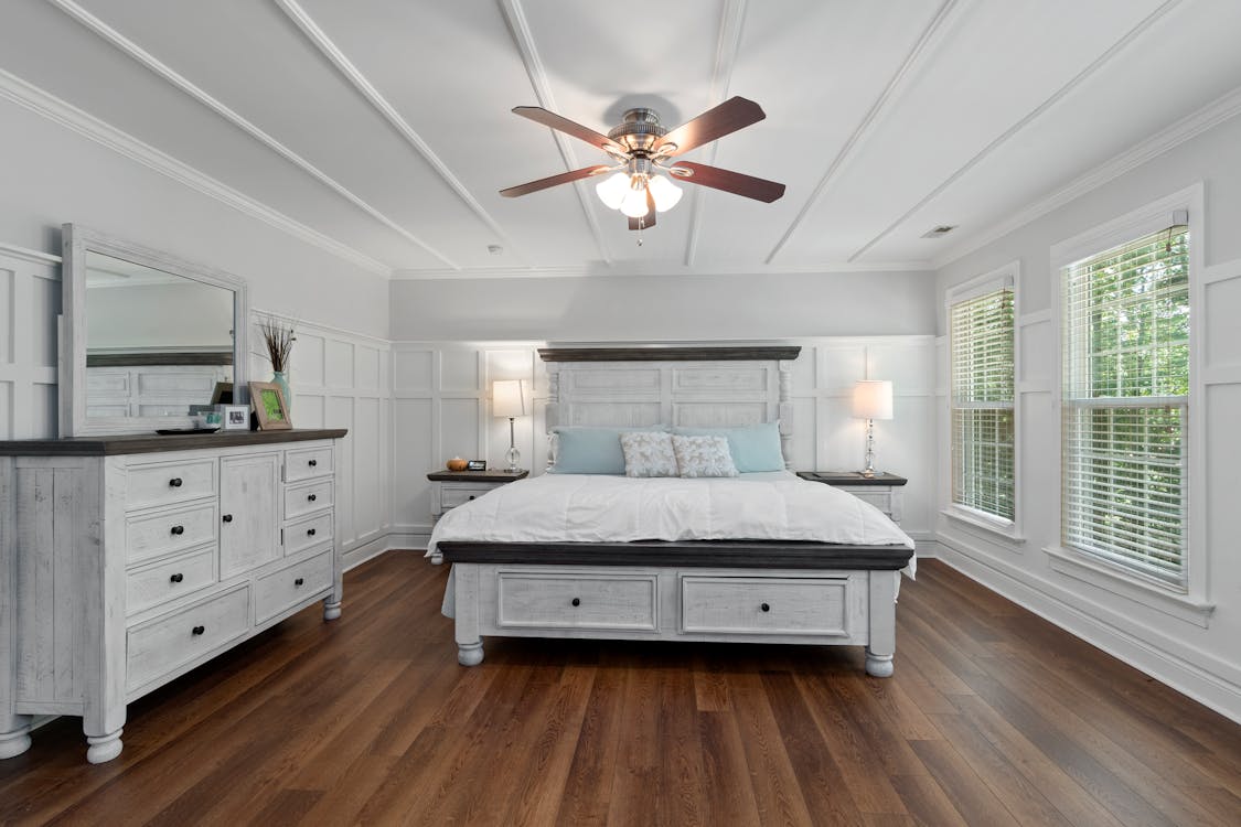 Contemporary Bedroom Design with Wooden Floor and White Walls
