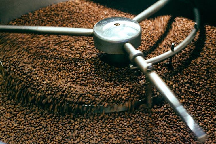 Coffee Beans Roasting In Professional Metal Equipment