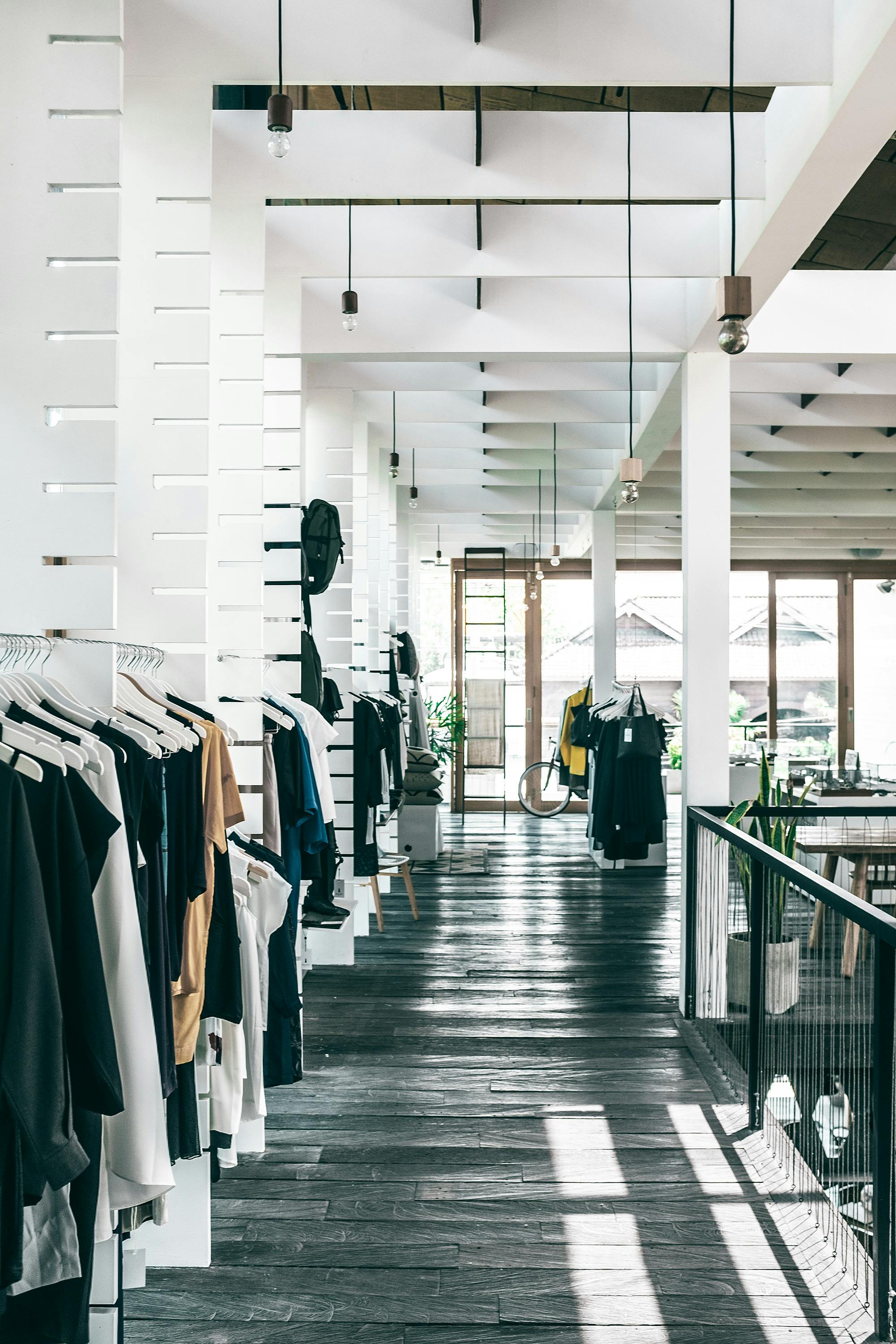 fashion store interior with garments hanging on racks