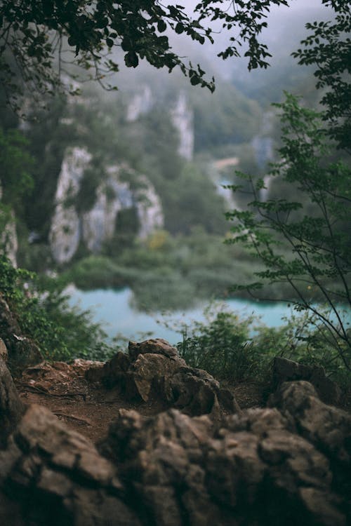 Peaceful blue lake surrounded by rocky coast