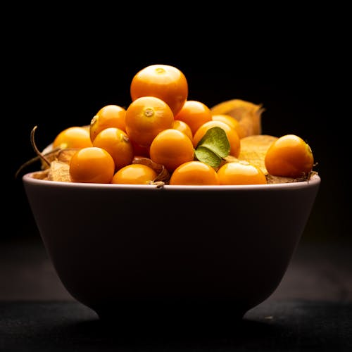 Free Fruits in Black Ceramic Bowl Stock Photo