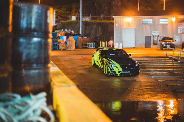 Modern Racing Car On City Road In Twilight