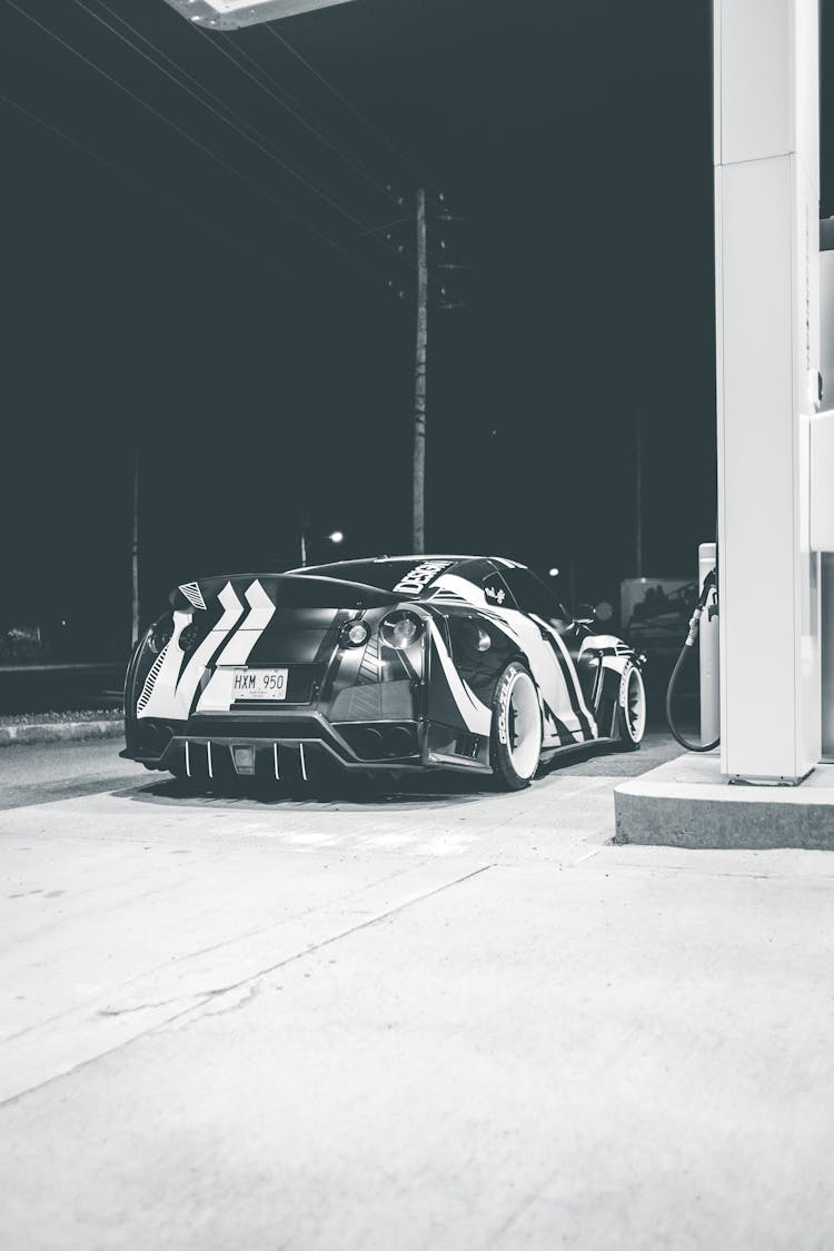 Racing Auto In Gas Station At Night