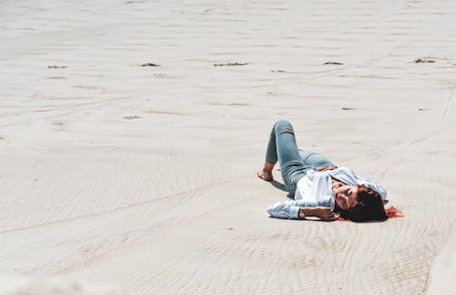 A Woman Lying Down in the Sand