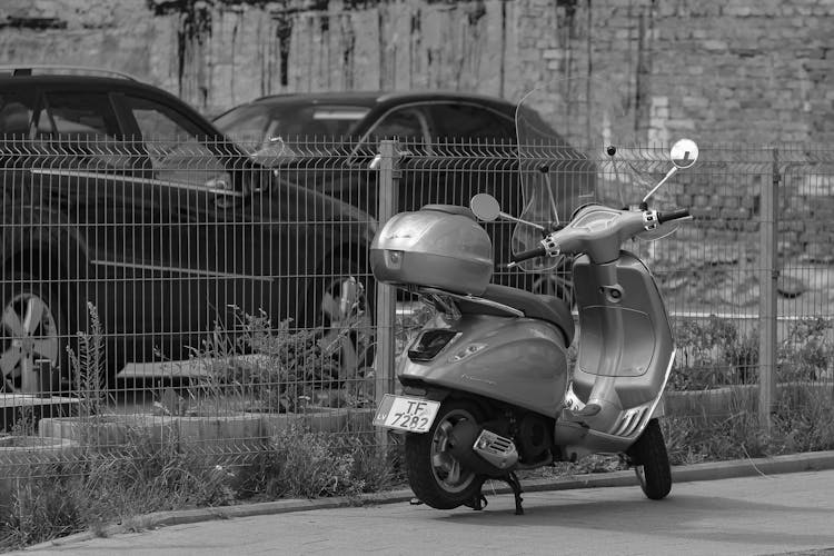 Modern Motor Scooter Parked On Roadside