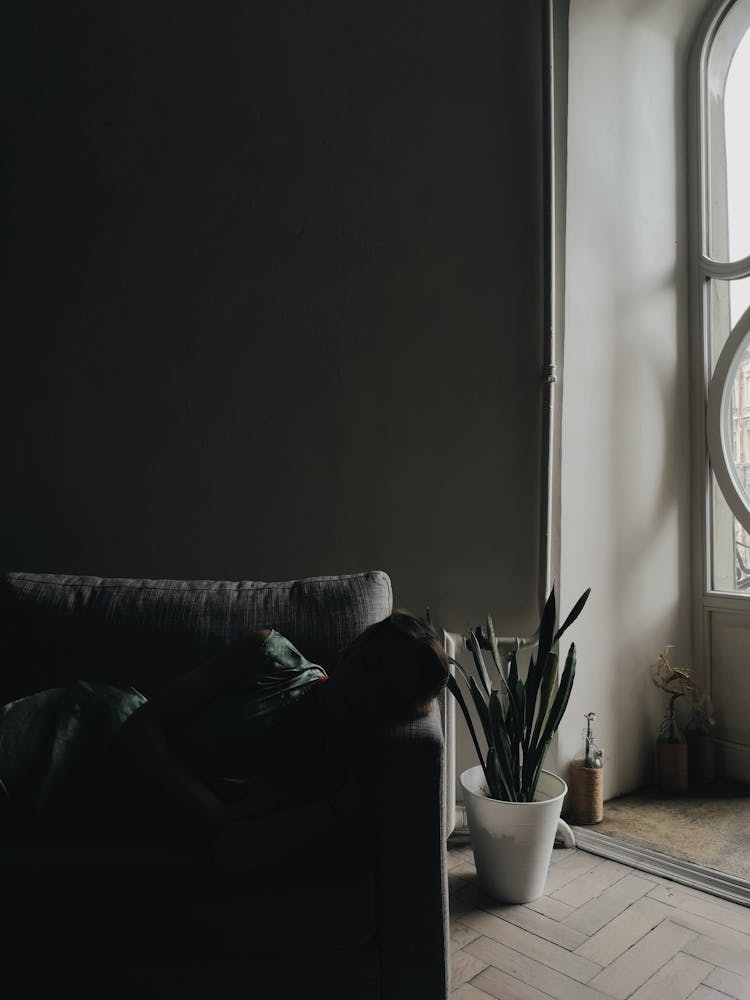 A Person Sleeping On The Couch