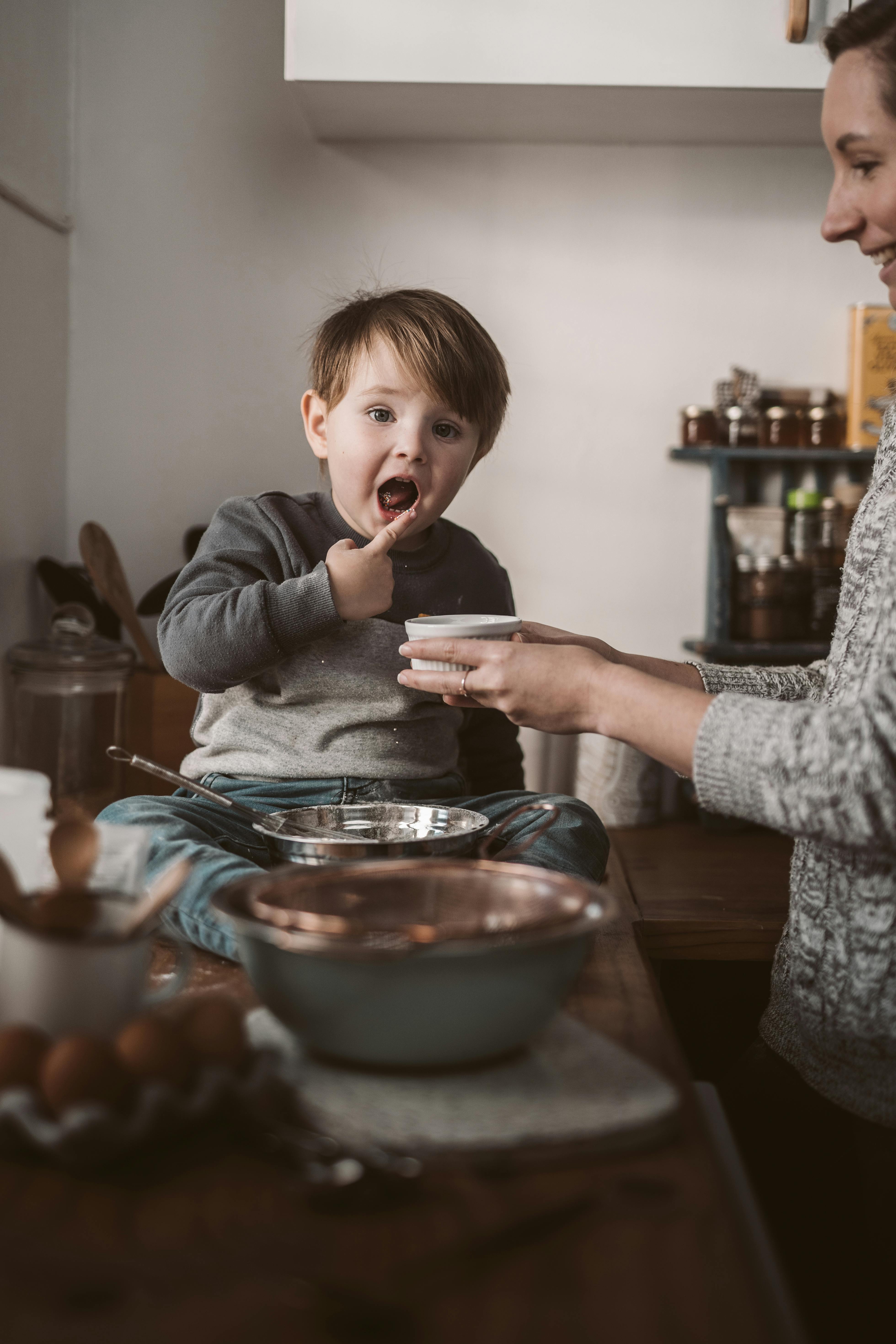 a boy sitting on the bowl