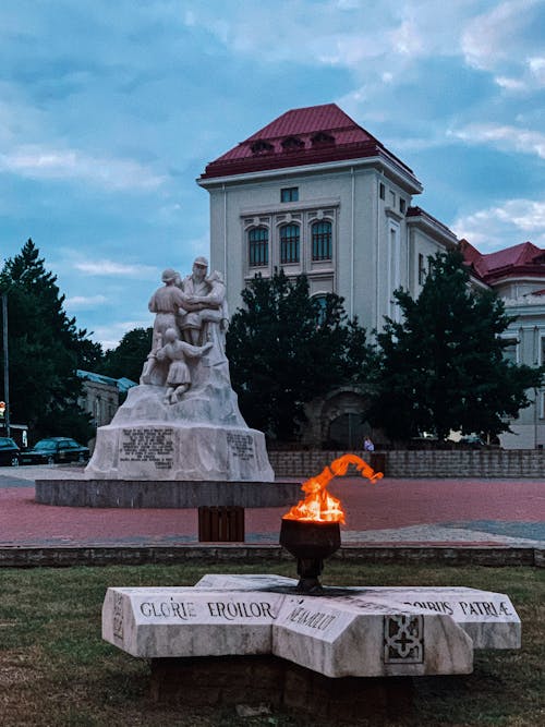 Memorial bonfire and statues near Romanian University