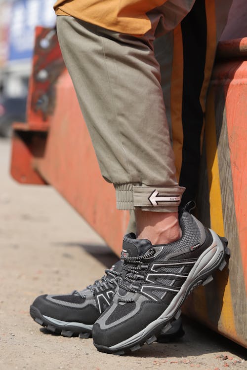 Free Person Wearing Black and White Hiking Shoes Stock Photo