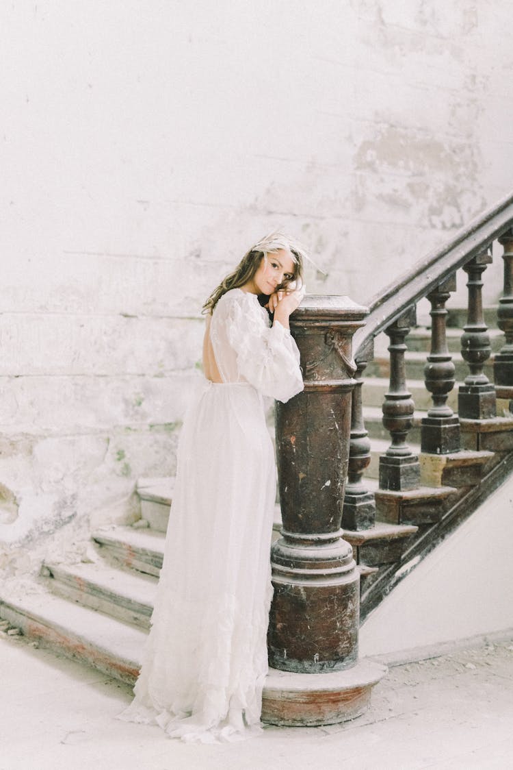 Gentle Bride At Classic Stairs In Snowfall