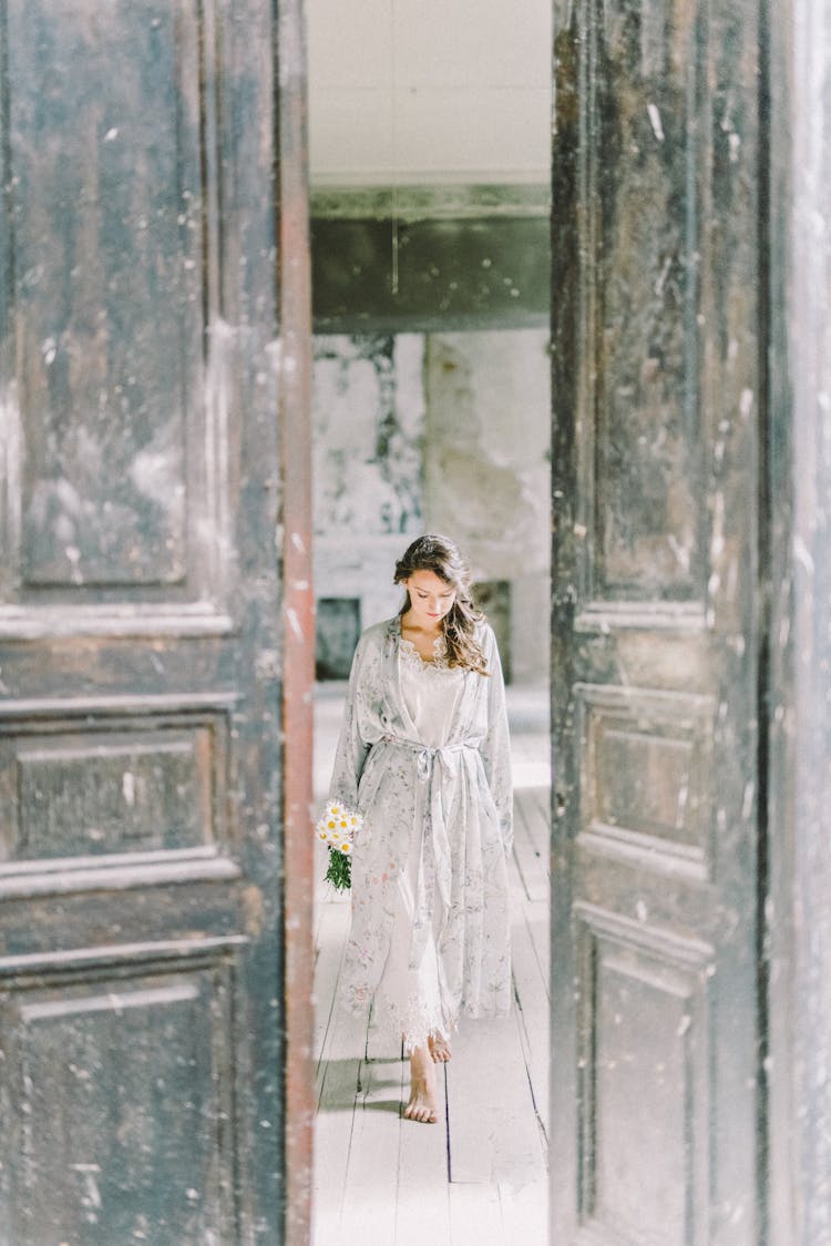 A Woman Walking Towards The Door