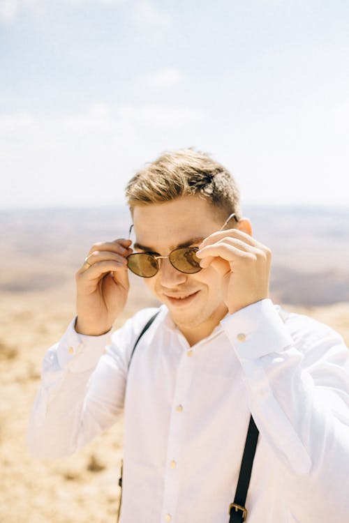 Man Wearing Sunglasses and White Long Sleeve Polo