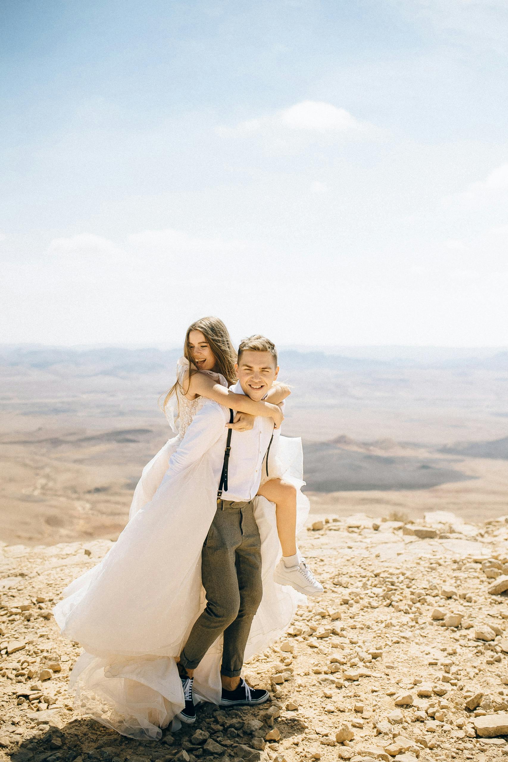 man carrying his bride