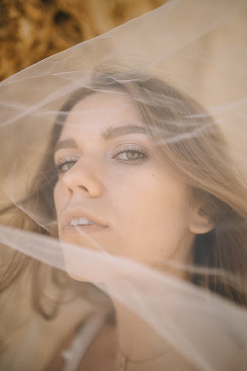 Close Up Photography of Woman in White Veil