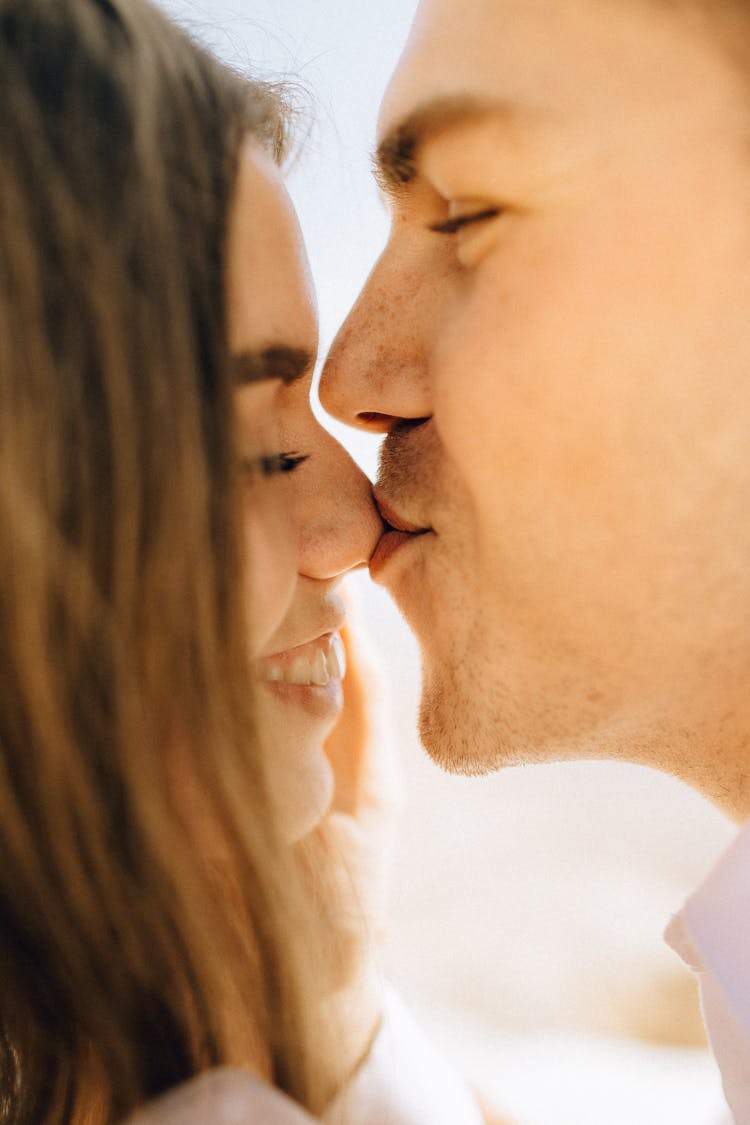 Close Up Photography Of Man Kissing Woman Nose