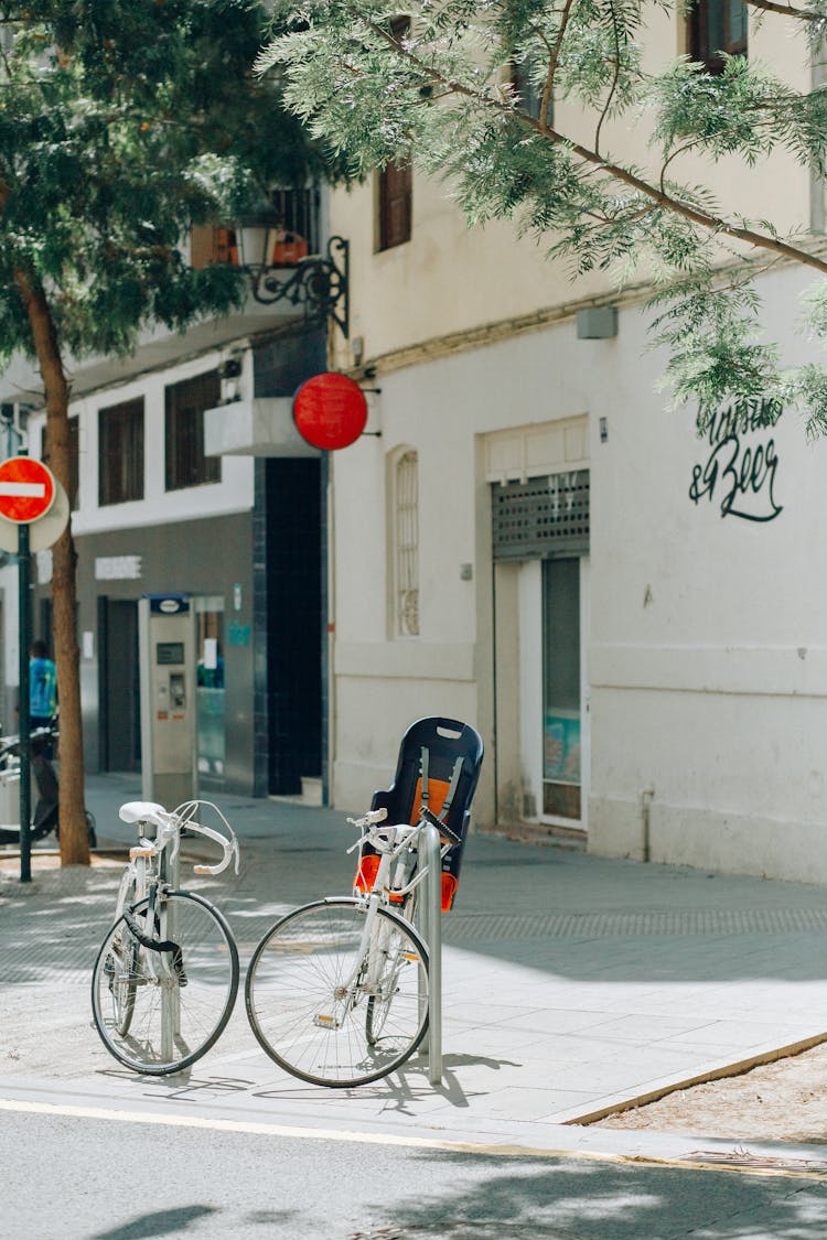 White City Bike Parked Beside White Concrete Building