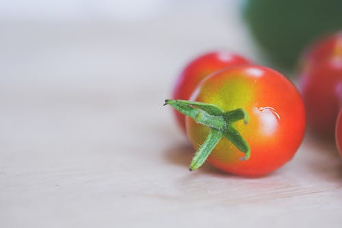 Selective Focus Photograph of a Cherry Tomato