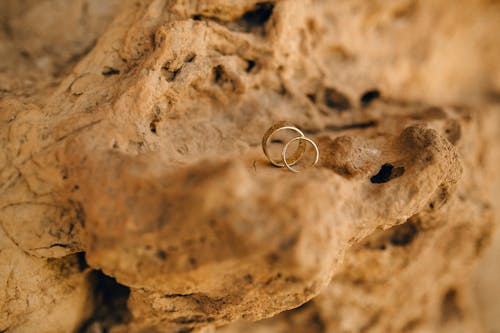 Free Photograph of Two Rings on a Brown Rock Stock Photo