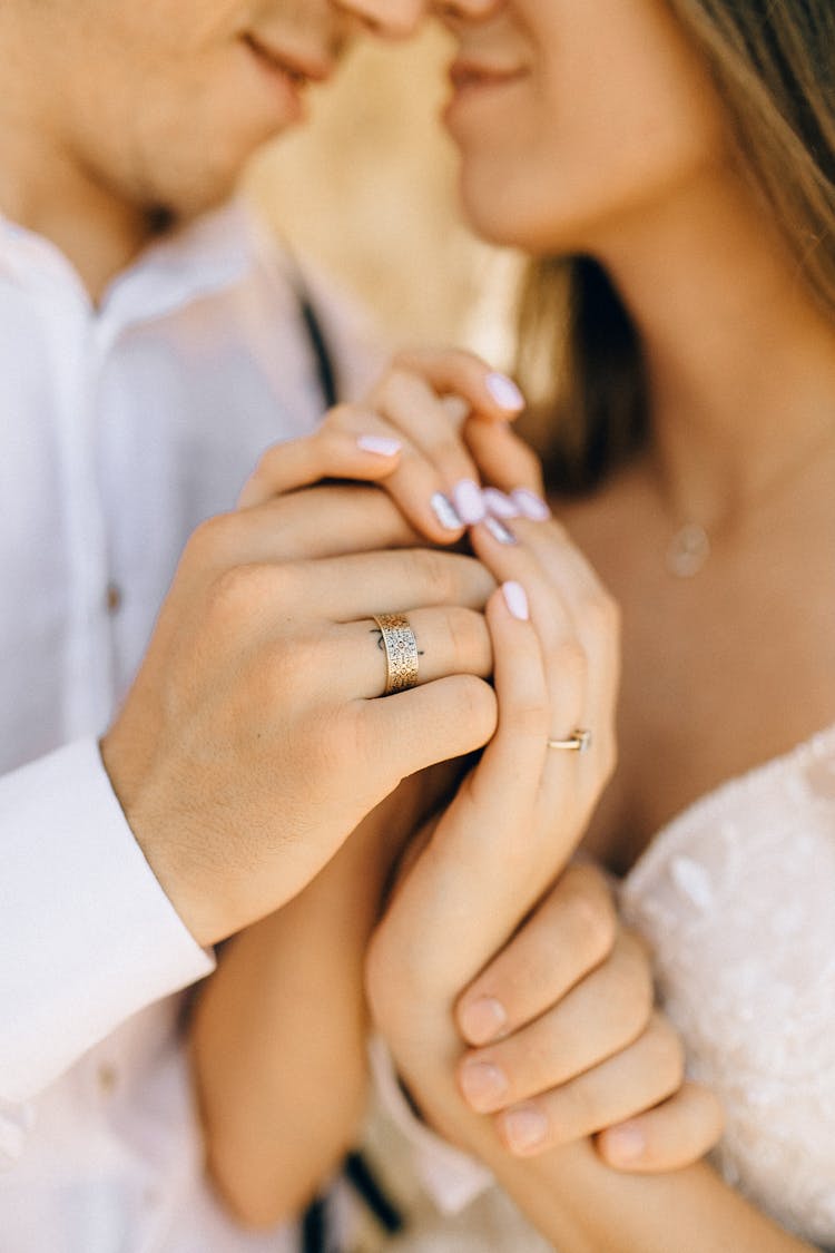 Couple Wearing Gold Rings