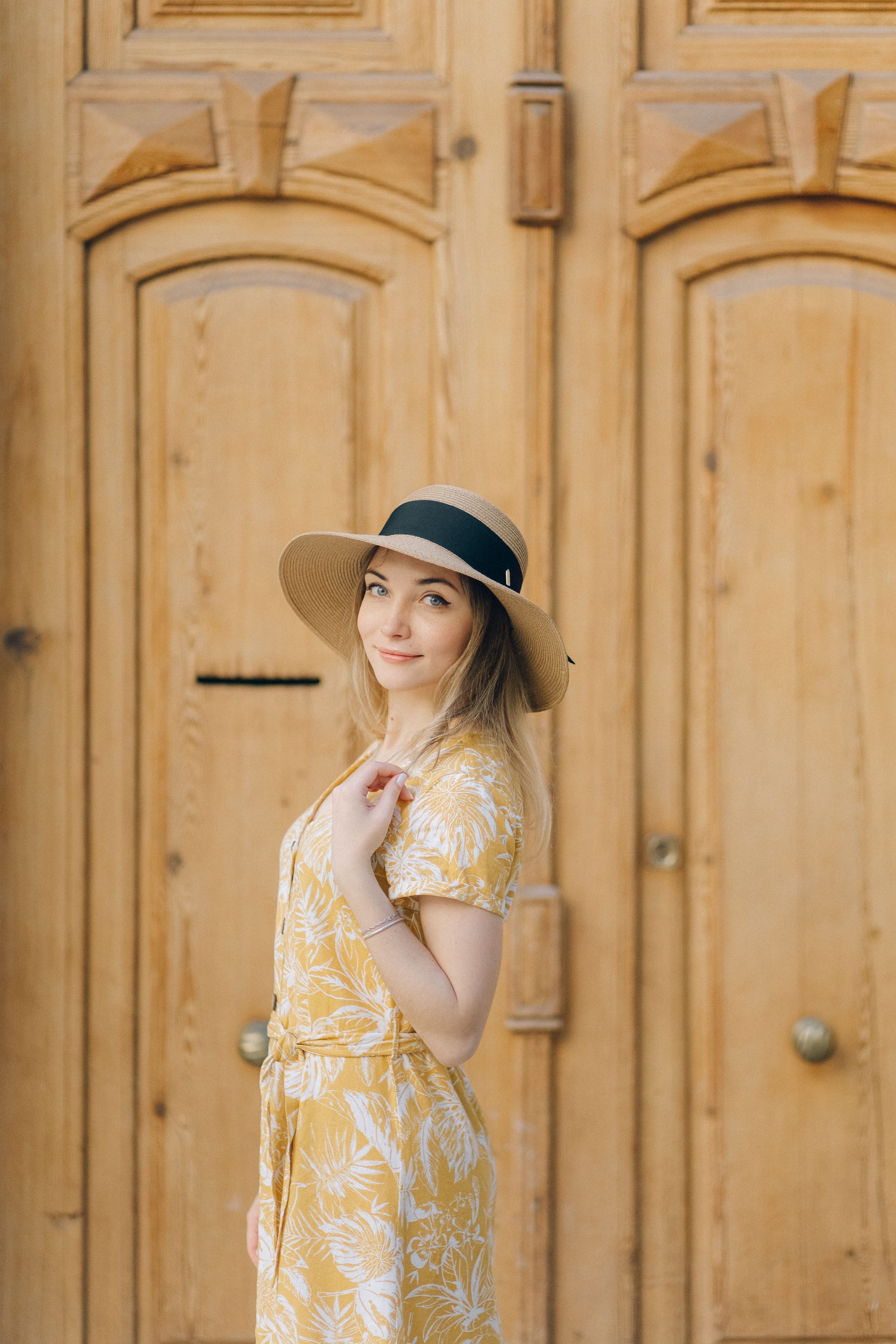 Pretty Woman in Yellow Dress and Sun Hat Looking at Camera · Free Stock ...