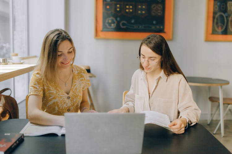 Photo Of Women Reading Books Together