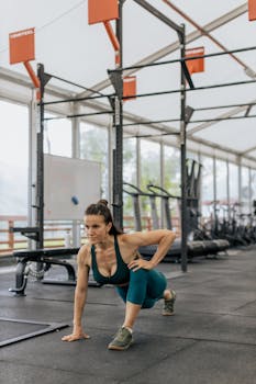 Woman performing exercise in a modern gym. Emphasis on fitness and healthy lifestyle.