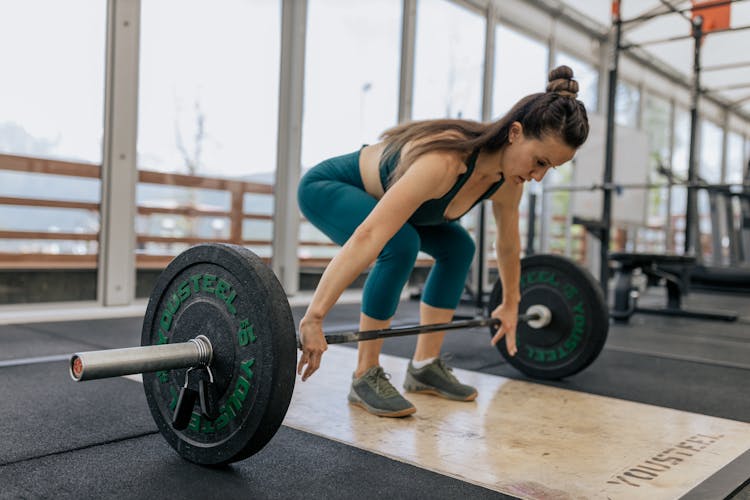 A Woman About To Carry A Barbell