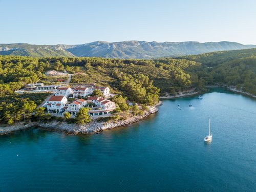 Free Breathtaking aerial shot of Jelsa's scenic coastline, capturing lush greenery and tranquil waters. Stock Photo