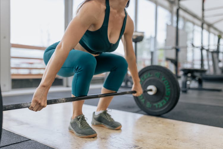 Woman Lifting A Barbell