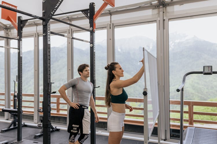 Woman Writing On A Whiteboard At The Gym