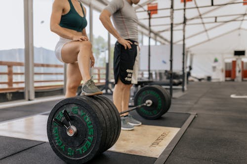 Couple Standing at Weights