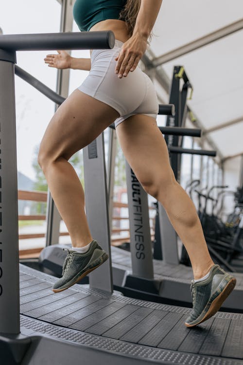 Free Woman Running on a Treadmill Stock Photo