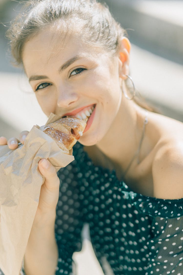 Pretty Woman Eating A Bread