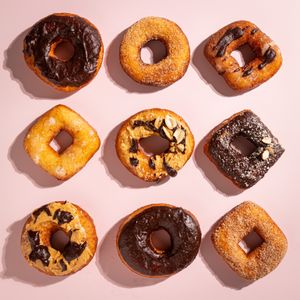 Aerial view of glazed doughnuts — photo by Lucie Liz on Pexels