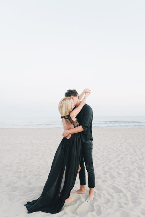 A Couple Kissing on the Beach