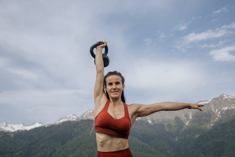 Photo Of A Woman Lifting A Kettlebell