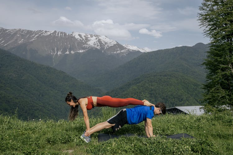 A Couple Exercising Outdoors