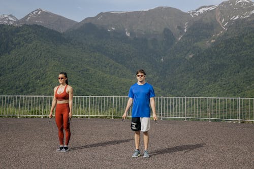 A Man and A Woman Exercising on the Viewing Deck
