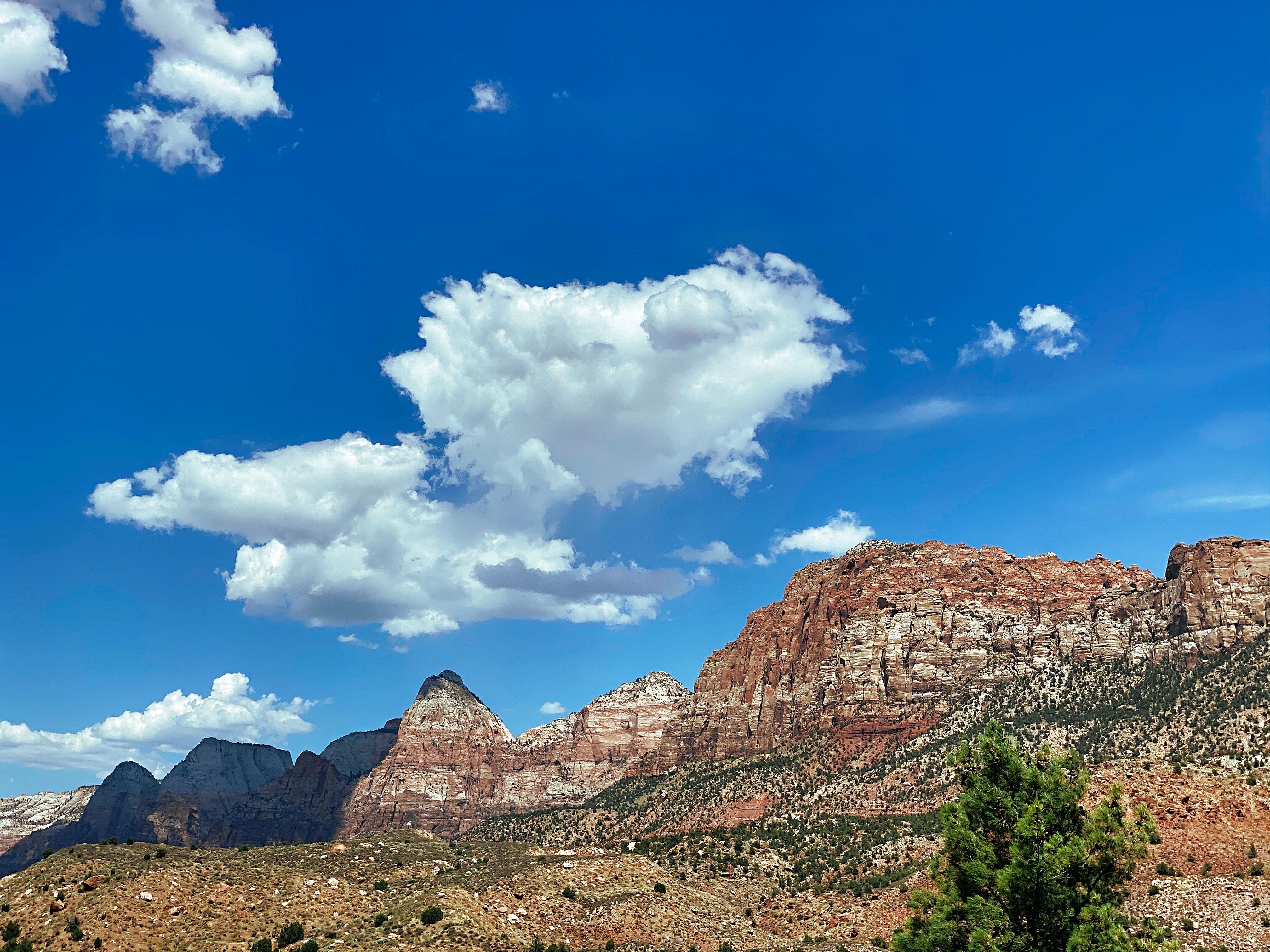 Brown Rocky Mountains Under the Blue Sky · Free Stock Photo