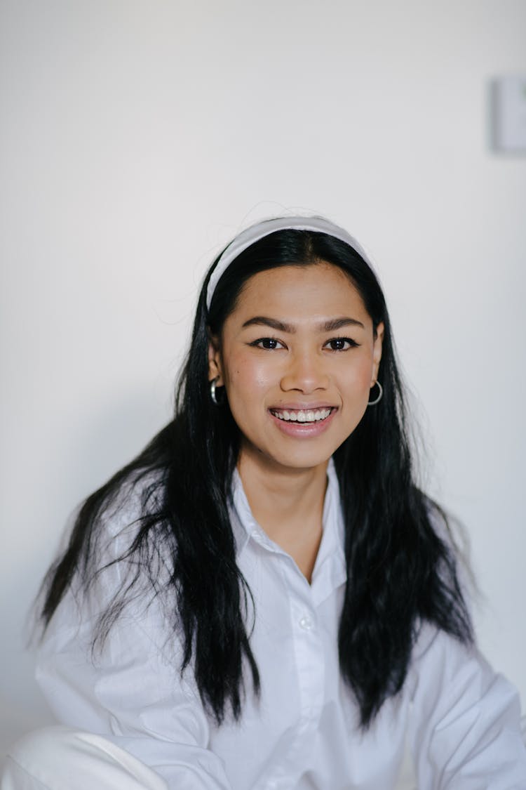 Happy Asian Woman In Light Room