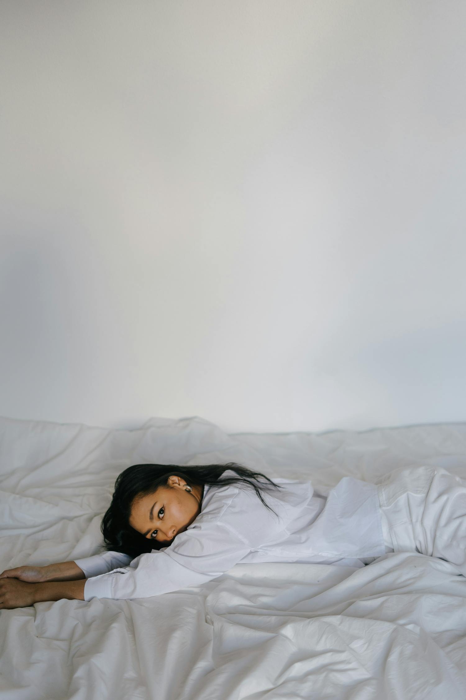 Feminine Asian Woman Lying On Comfy Bed Free Stock Photo Feminine Asian Woman Lying On Comfy Bed Free Stock Photo