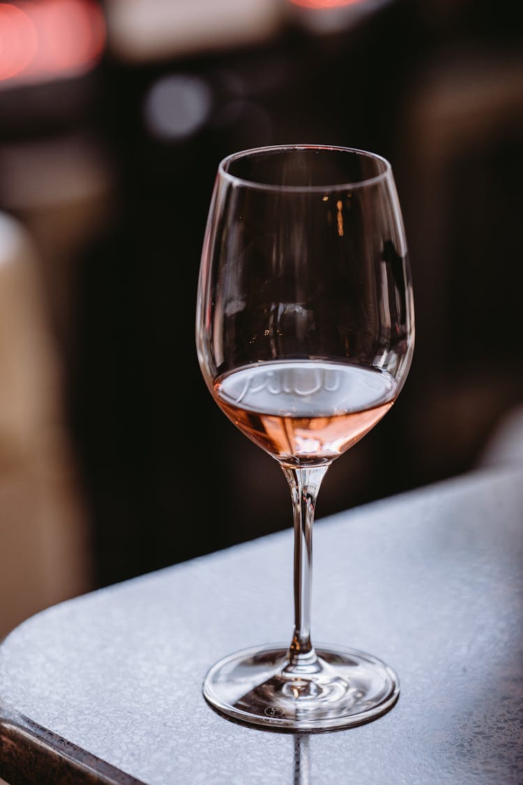 Glass Of Fine Rose Wine On Table