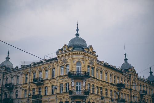 Free Exterior of majestic historical building with decorative domes and ornamental stucco work on gloomy day in Saint Petersburg Stock Photo