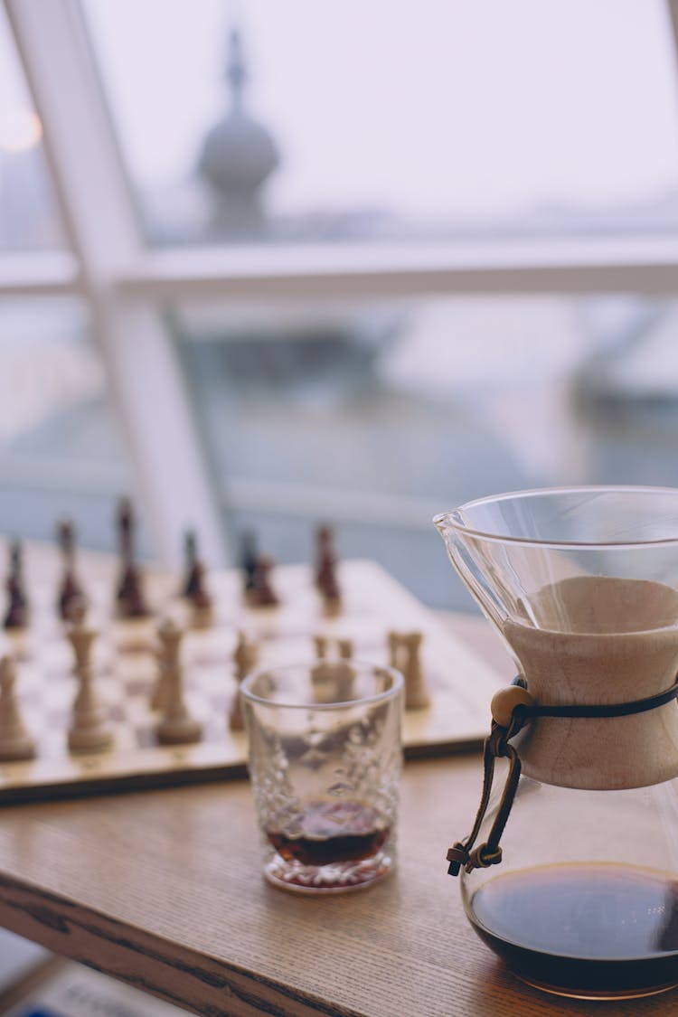 Table With Coffee And Glass Against Window