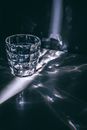 Glass with refraction pattern in darkness