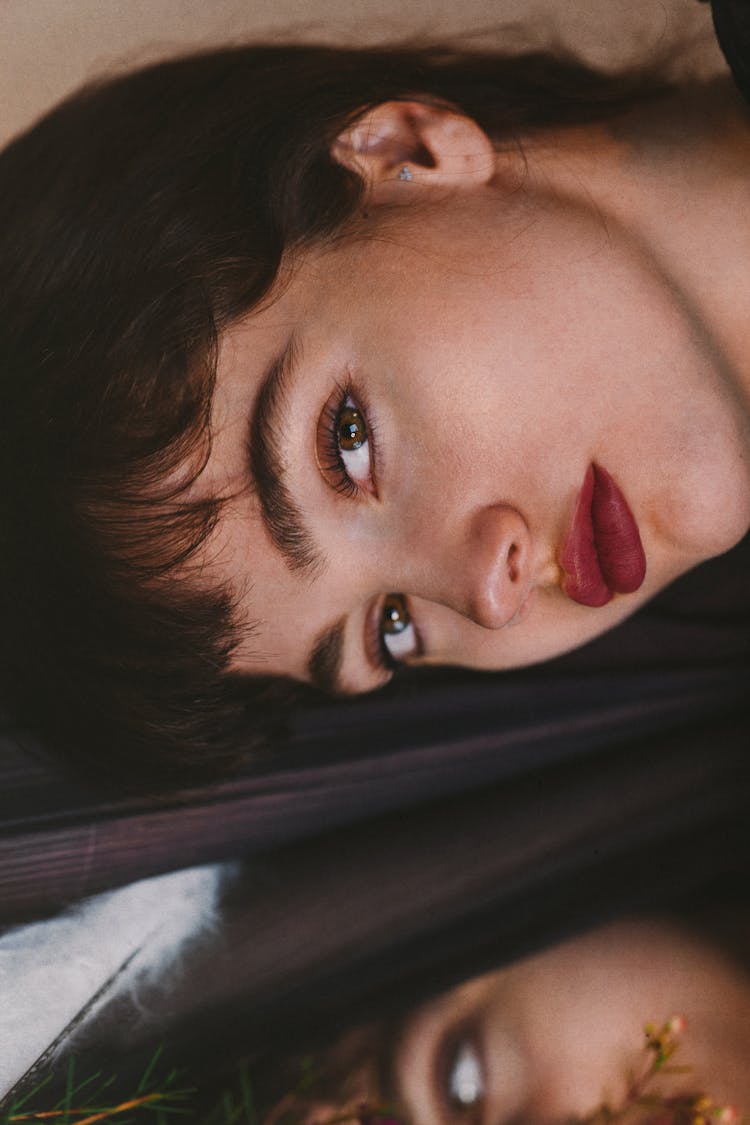 Woman With Red Lips And Dark Hair